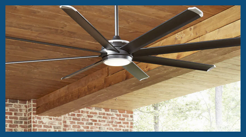 A Fanimation Stellar ceiling fan hanging up outside in a patio.